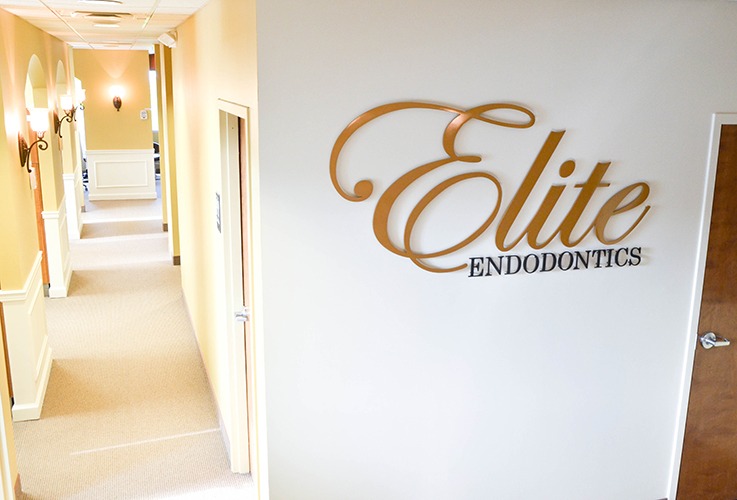 Elite Endodontics sign and hallway