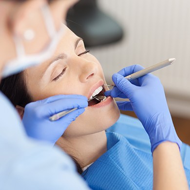 Woman receiving dental exam